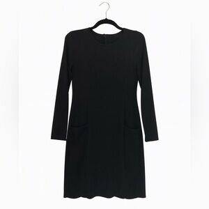 The Limited Size 4 Black Long-Sleeved Black Dress with Pleated Bottom.